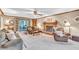 Comfortable living room featuring a cozy fireplace and access to a screened-in porch at 241 Tweed Ct, Sugar Hill, GA 30518