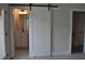 Bathroom featuring a modern sliding barn door, vanity, and mirror at 285 White St # 4, Marietta, GA 30060