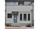 Charming townhouse exterior with brick accents, gray paint, and trimmed windows and door with covered entry at 285 White St # 4, Marietta, GA 30060