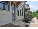 Townhouse exterior showing brick steps, neutral paint, trimmed windows, and covered entry with wood corbels at 285 White St # 4, Marietta, GA 30060