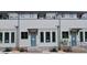 Modern townhouse exterior with neutral colors, brick foundation, trimmed windows, and newly installed landscaping at 285 White St # 4, Marietta, GA 30060