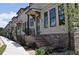 Elegant townhome exteriors showcasing brick accents, covered entrances, and well-maintained landscaping at 285 White St # 4, Marietta, GA 30060