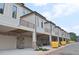 Townhomes with attached garages, private balconies, and professionally landscaped grounds at 285 White St # 4, Marietta, GA 30060