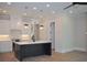 Modern kitchen featuring an island with a sink and pendant lights, plus white cabinets and appliances at 285 White St # 4, Marietta, GA 30060