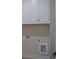 White cabinets above the laundry units at 285 White St # 4, Marietta, GA 30060