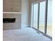 Bright living room featuring a modern fireplace with tile surround and sliding glass doors to a deck at 285 White St # 4, Marietta, GA 30060