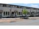 Modern townhomes feature covered entryways and large windows, set along a freshly paved street at 285 White St # 4, Marietta, GA 30060