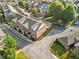 Aerial view of the community showcasing well-maintained townhomes, landscaping, and street layout at 5029 Rosalie Rd, Johns Creek, GA 30022