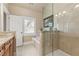 Bright bathroom featuring separate tub and frameless glass shower at 5029 Rosalie Rd, Johns Creek, GA 30022