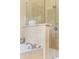 Bright bathroom features a tiled shower with glass partition and a relaxing soaking tub at 5029 Rosalie Rd, Johns Creek, GA 30022