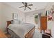 Cozy bedroom featuring a ceiling fan, a comfortable queen-sized bed, and natural light at 5029 Rosalie Rd, Johns Creek, GA 30022