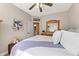 Comfortable bedroom featuring light-filled room, ceiling fan, and a stylish decor at 5029 Rosalie Rd, Johns Creek, GA 30022