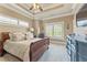 Spacious primary bedroom featuring decorative crown molding and natural light at 5029 Rosalie Rd, Johns Creek, GA 30022