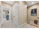 Upstairs hallway with neutral carpet, closet, and framed artwork at 5029 Rosalie Rd, Johns Creek, GA 30022