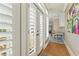 Hallway with hardwood floors, decorative shutters, and wall decor at 5029 Rosalie Rd, Johns Creek, GA 30022