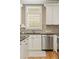 Close up of a well-appointed kitchen area with a stainless steel dishwasher at 5029 Rosalie Rd, Johns Creek, GA 30022