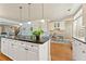 Kitchen island with granite counters and stainless steel appliances at 5029 Rosalie Rd, Johns Creek, GA 30022