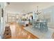 Open-concept kitchen and dining area with hardwood floors and natural light at 5029 Rosalie Rd, Johns Creek, GA 30022