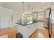 Bright kitchen featuring an expansive island and abundant cabinet space at 5029 Rosalie Rd, Johns Creek, GA 30022