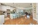 Open kitchen with island seating flows seamlessly into the dining and living areas at 5029 Rosalie Rd, Johns Creek, GA 30022