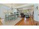 Open concept living area and dining area with hardwood floors and lots of natural light at 5029 Rosalie Rd, Johns Creek, GA 30022