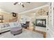 Inviting living room with hardwood floors, a fireplace, and an open floor plan design at 5029 Rosalie Rd, Johns Creek, GA 30022