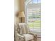 Cozy seating area featuring a side window with light-filtering plantation shutters at 5029 Rosalie Rd, Johns Creek, GA 30022
