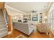 Bright living room featuring hardwood floors, built-in bookshelves, and an open floor plan at 5029 Rosalie Rd, Johns Creek, GA 30022