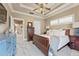 Serene main bedroom with tray ceiling, neutral tones, and ample natural light at 5029 Rosalie Rd, Johns Creek, GA 30022