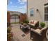 Private outdoor patio with comfortable seating area, brick pavers, and gated access at 5029 Rosalie Rd, Johns Creek, GA 30022