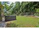 Backyard view of a well-kept lawn and a hot tub at 895 Mill Garden Pl, Cumming, GA 30040
