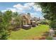 Expansive backyard with patio featuring dining and hot tub; perfect for outdoor living at 895 Mill Garden Pl, Cumming, GA 30040