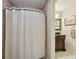 Cozy bathroom featuring a shower with a stylish curtain and vanity with granite countertop at 895 Mill Garden Pl, Cumming, GA 30040