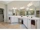 Elegant bathroom with a soaking tub, glass shower, and double vanity sinks at 895 Mill Garden Pl, Cumming, GA 30040