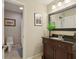 Bathroom with dark wood vanity and sink, showing a clean and functional space at 895 Mill Garden Pl, Cumming, GA 30040