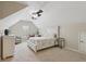 Spacious bedroom with carpet, a large bed, ceiling fan, and an accent chair at 895 Mill Garden Pl, Cumming, GA 30040
