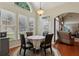 Bright breakfast area with large windows and access to the backyard at 895 Mill Garden Pl, Cumming, GA 30040