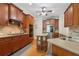 Kitchen features stainless steel appliances, wood cabinets, and ample counter space at 895 Mill Garden Pl, Cumming, GA 30040