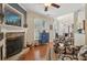 Inviting living room with a stone fireplace and hardwood floors, perfect for relaxation at 895 Mill Garden Pl, Cumming, GA 30040