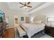 Bright main bedroom with neutral decor, tray ceilings, and a spacious layout at 895 Mill Garden Pl, Cumming, GA 30040