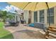 Spacious backyard patio with dining set, hot tub, grill, and ample space for entertaining at 895 Mill Garden Pl, Cumming, GA 30040
