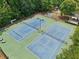 Overhead shot showcasing community tennis courts and play area at 895 Mill Garden Pl, Cumming, GA 30040