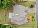Bird's eye view showcases roof, patio, colorful landscaping, and surrounding greenery at 977 Frog Leap Trail Nw, Kennesaw, GA 30152