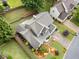 Overhead shot of home showcasing roof, landscaping, driveway, and perimeter foliage at 977 Frog Leap Trail Nw, Kennesaw, GA 30152