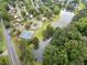 Aerial view of the community with a swimming pool, playground, tennis courts and a pond at 977 Frog Leap Trail Nw, Kennesaw, GA 30152