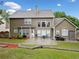 Spacious backyard featuring a patio, lush green lawn, and well-maintained landscaping at 977 Frog Leap Trail Nw, Kennesaw, GA 30152
