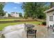 Patio with outdoor seating, level lawn, garden beds, and perimeter fencing at 977 Frog Leap Trail Nw, Kennesaw, GA 30152