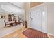 Spacious foyer with wood flooring, offering a glimpse into the elegant dining room at 977 Frog Leap Trail Nw, Kennesaw, GA 30152