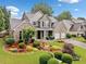 Attractive two-story home with brick, well-maintained landscaping, and an attached two-car garage at 977 Frog Leap Trail Nw, Kennesaw, GA 30152