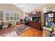 Spacious home office with custom built-ins, hard wood floor, and ample natural light at 977 Frog Leap Trail Nw, Kennesaw, GA 30152